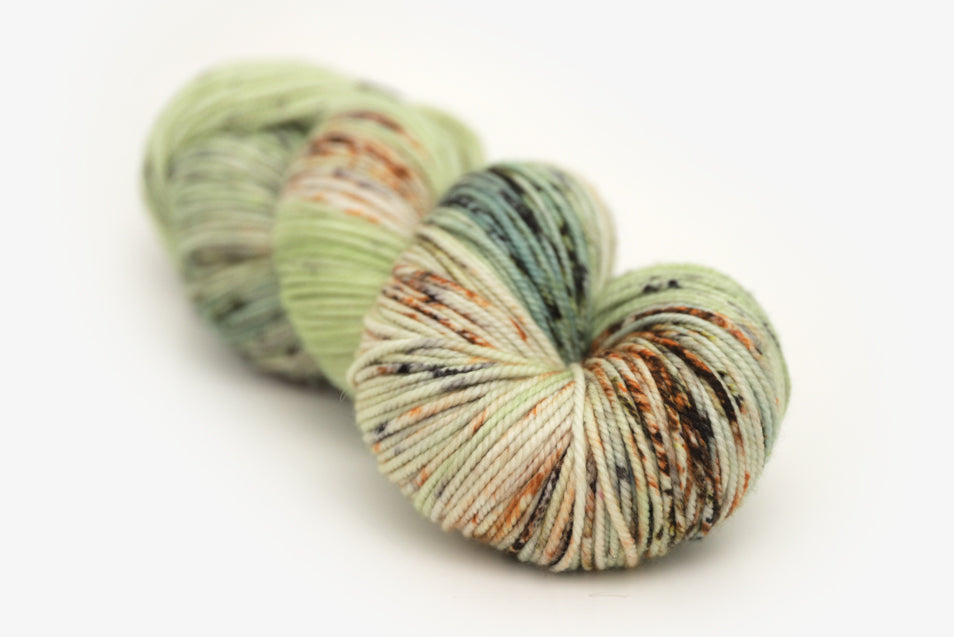 speckled hand dyed pale green sage peach bulky yarn