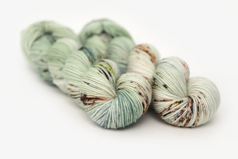 speckled hand dyed pale green sage peach dk yarn