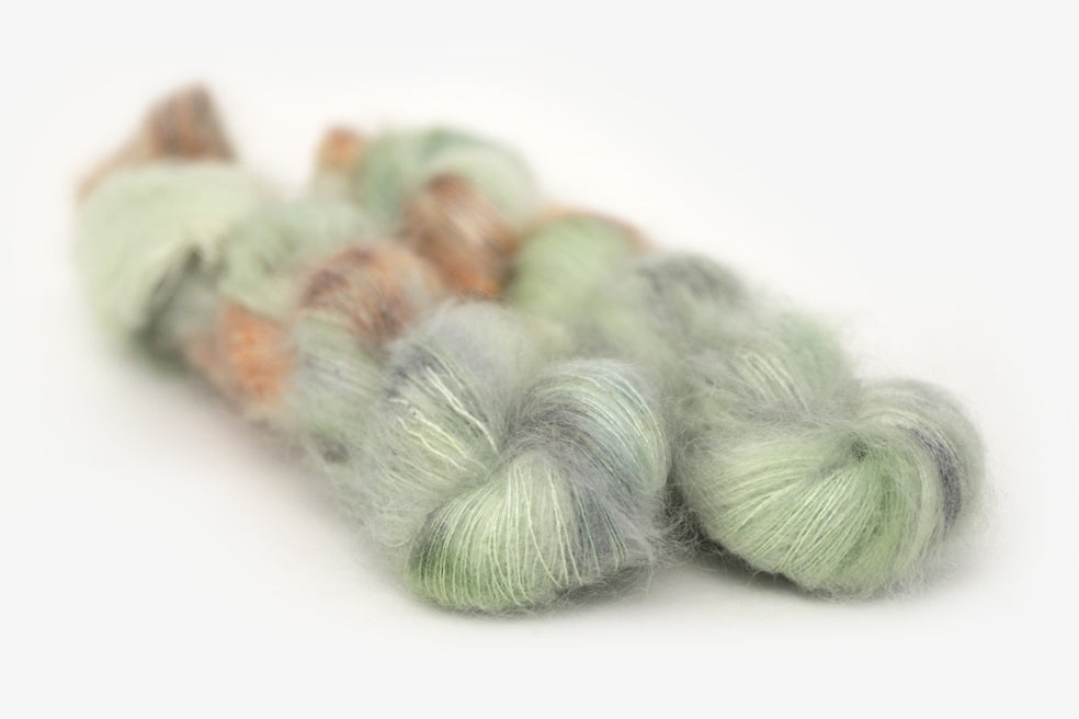 speckled hand dyed pale green sage peach mohair lace yarn