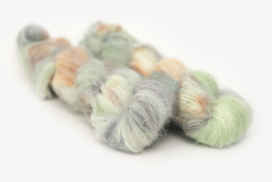 speckled hand dyed pale green sage peach alpaca suri lace yarn