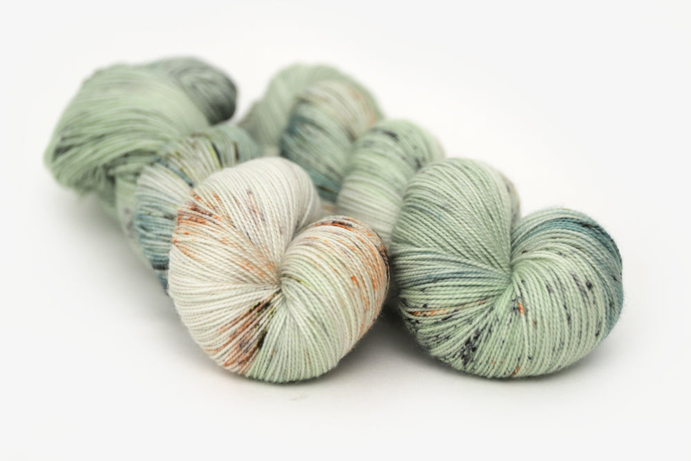 speckled hand dyed pale green sage peach spun xl yarn