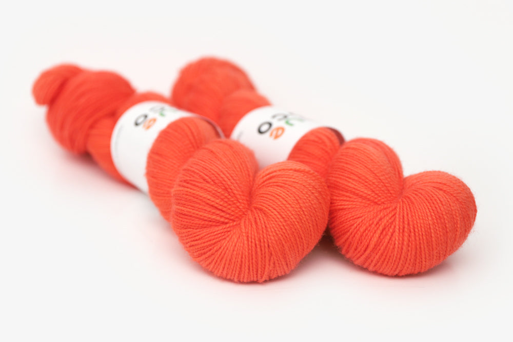 semisolid hand dyed poppy (bright orange red) merino sock yarn