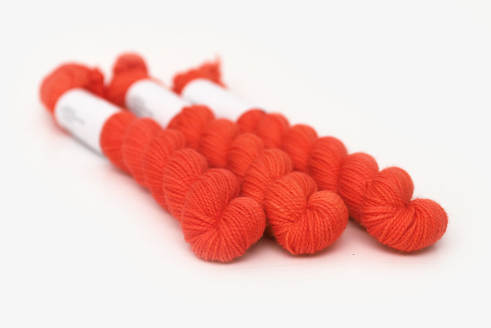 semisolid hand dyed poppy (bright orange red) merino sock mini yarn