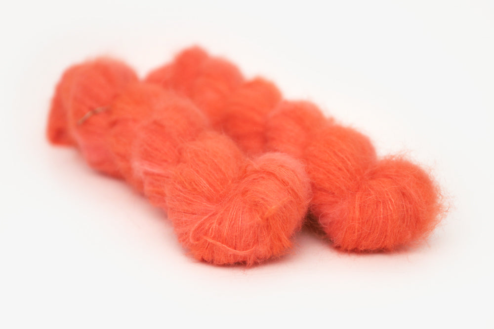 semisolid hand dyed poppy (bright orange red) alpaca suri lace yarn