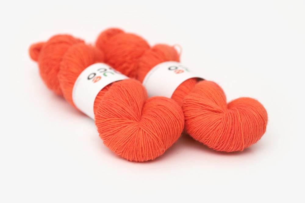 semisolid hand dyed poppy (bright orange red) single sock yarn