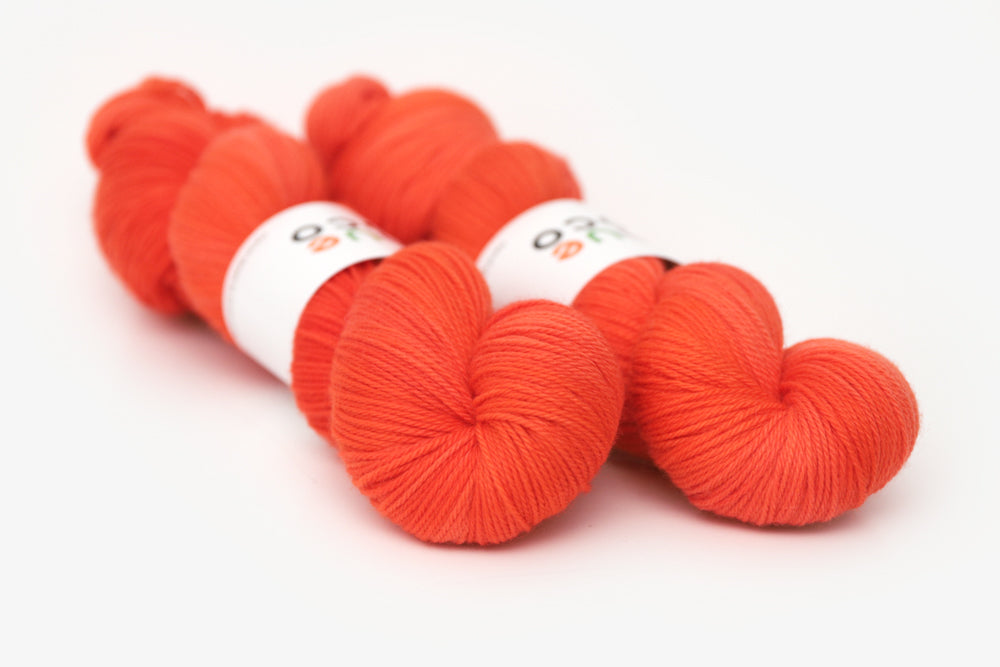 semisolid hand dyed poppy (bright orange red) worsted yarn