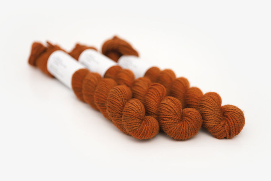 semisolid hand dyed pumpkin (dark burnt orange) merino sock mini yarn