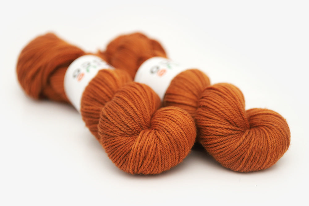semisolid hand dyed pumpkin (dark burnt orange) worsted yarn