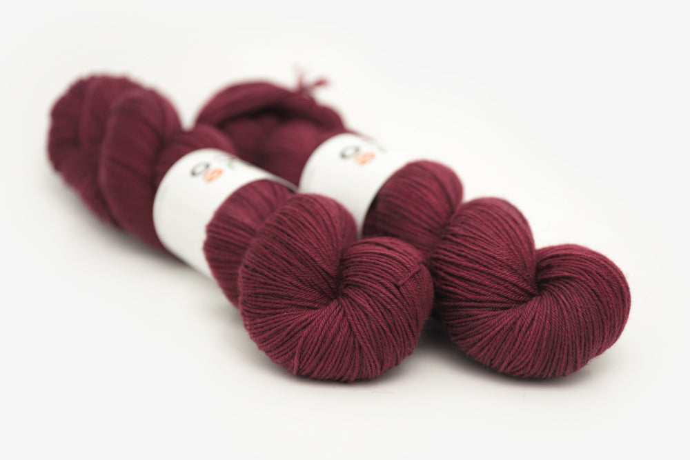 semisolid hand dyed sangria (dark wine burgundy red) phyllis sock yarn