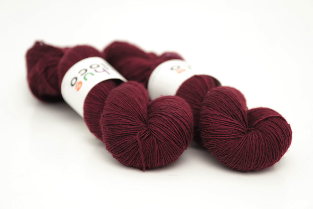 semisolid hand dyed sangria (dark wine burgundy red) single sock yarn