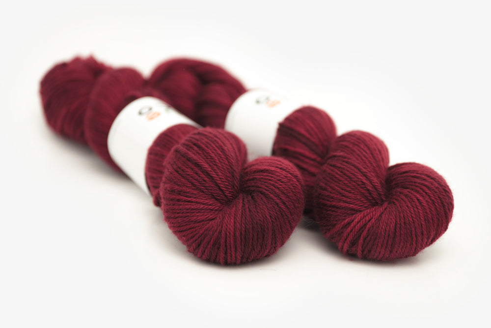 semisolid hand dyed sangria (dark wine burgundy red) worsted yarn