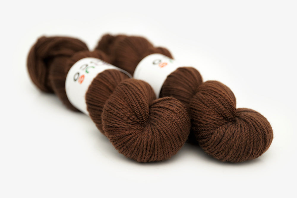 semisolid hand dyed dark warm brown worsted yarn