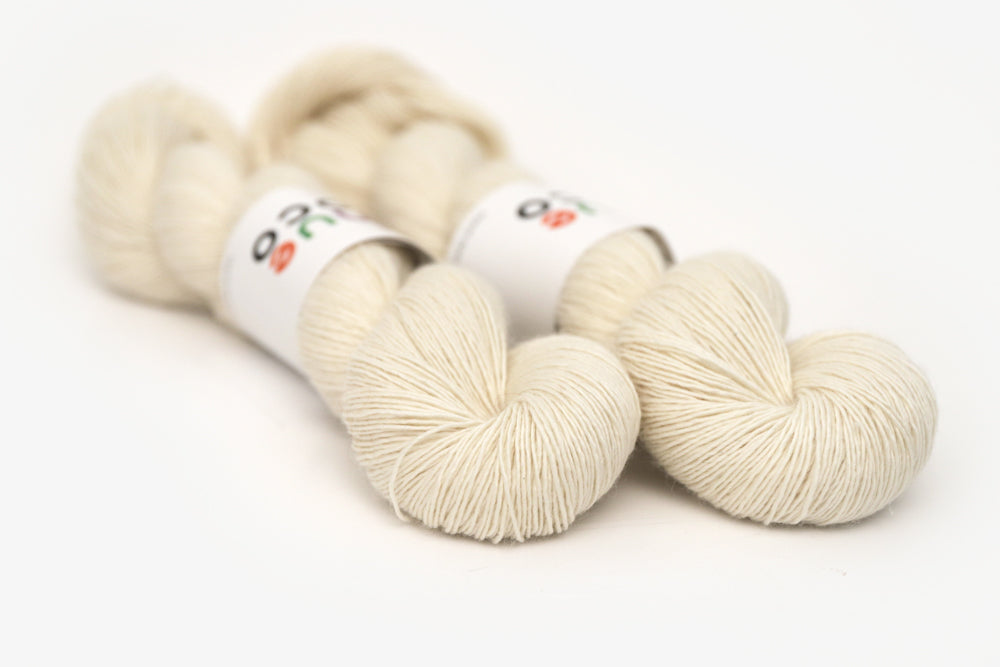 semisolid hand dyed ivory white single sock yarn