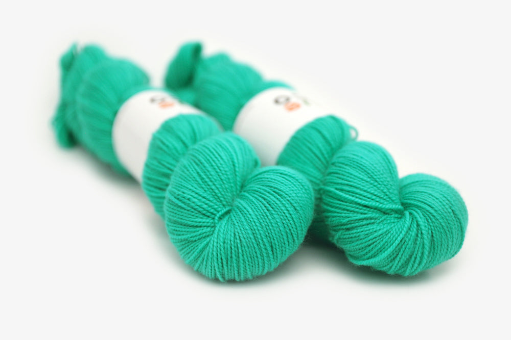 semisolid hand dyed spearmint (bright mint green) merino sock yarn
