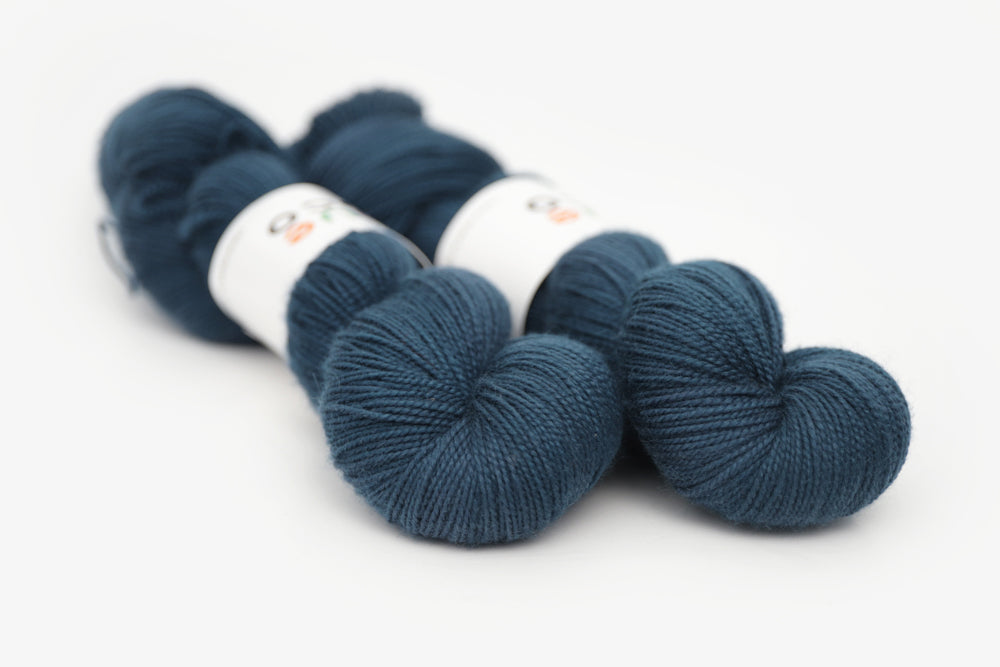 semisolid hand dyed spruce (dark teal green) merino sock yarn