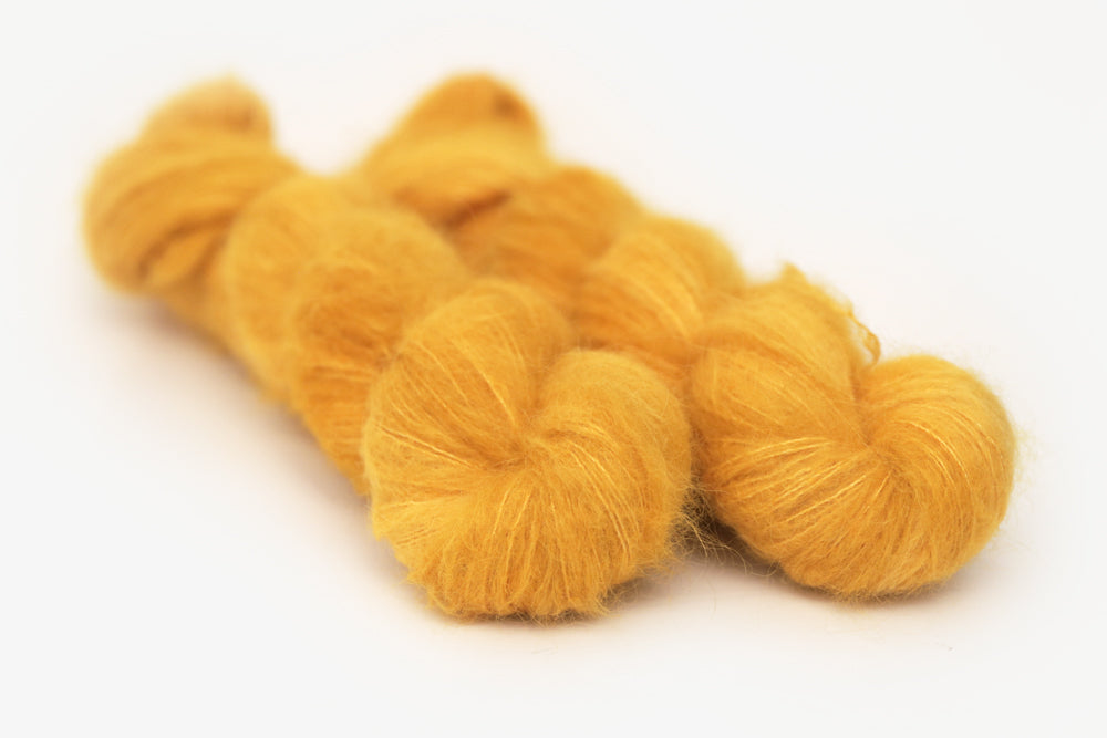semisolid hand dyed squash (mustard gold yellow) alpaca suri lace yarn
