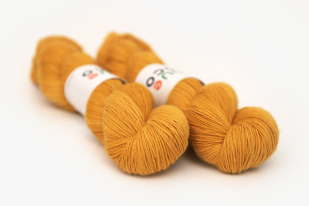 semisolid hand dyed squash (mustard gold yellow) single sock yarn