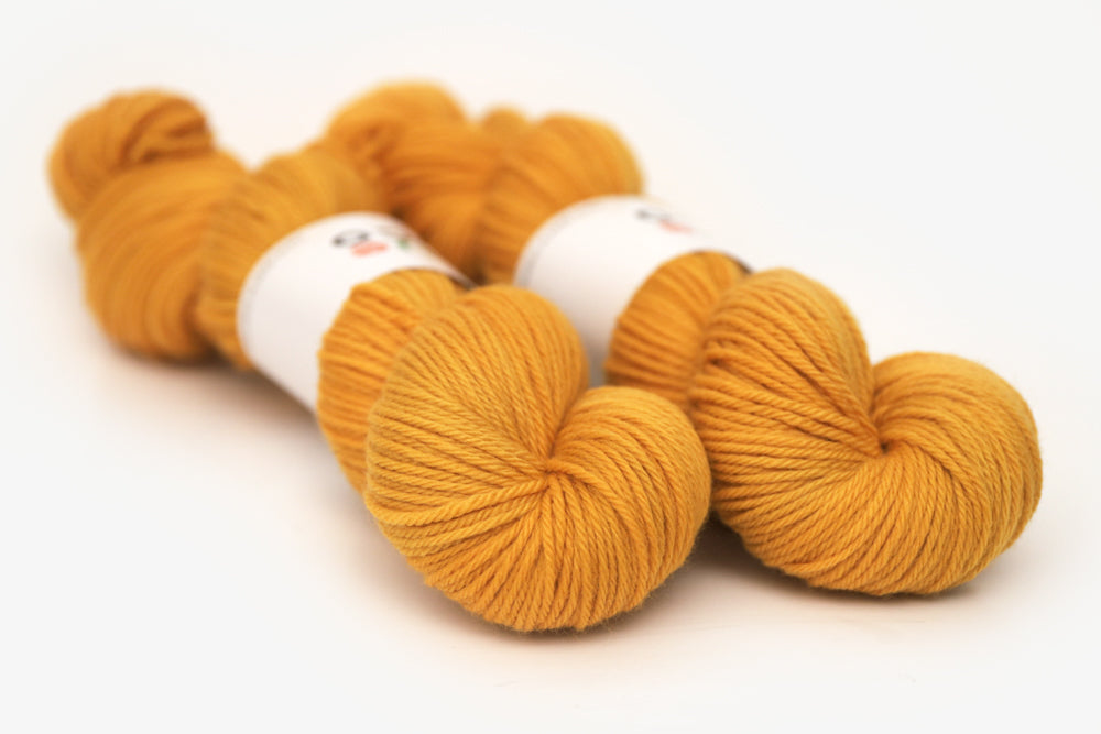 semisolid hand dyed squash (mustard gold yellow) worsted yarn