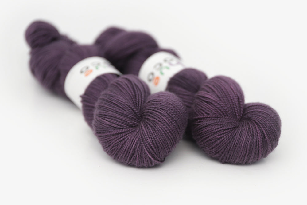 semisolid hand dyed vineyard (dark wine purple) merino sock yarn