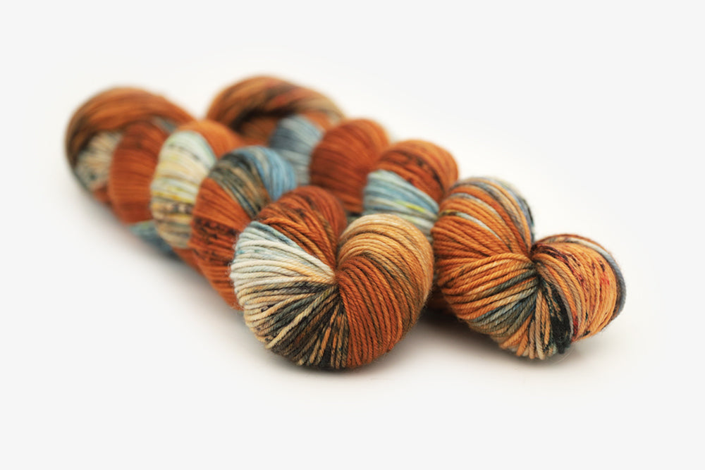 speckled hand dyed burnt orange teal green dk yarn