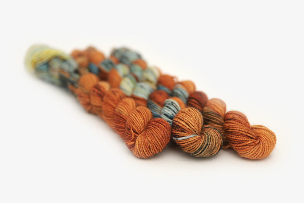 speckled hand dyed burnt orange teal green phyllis sock mini yarn