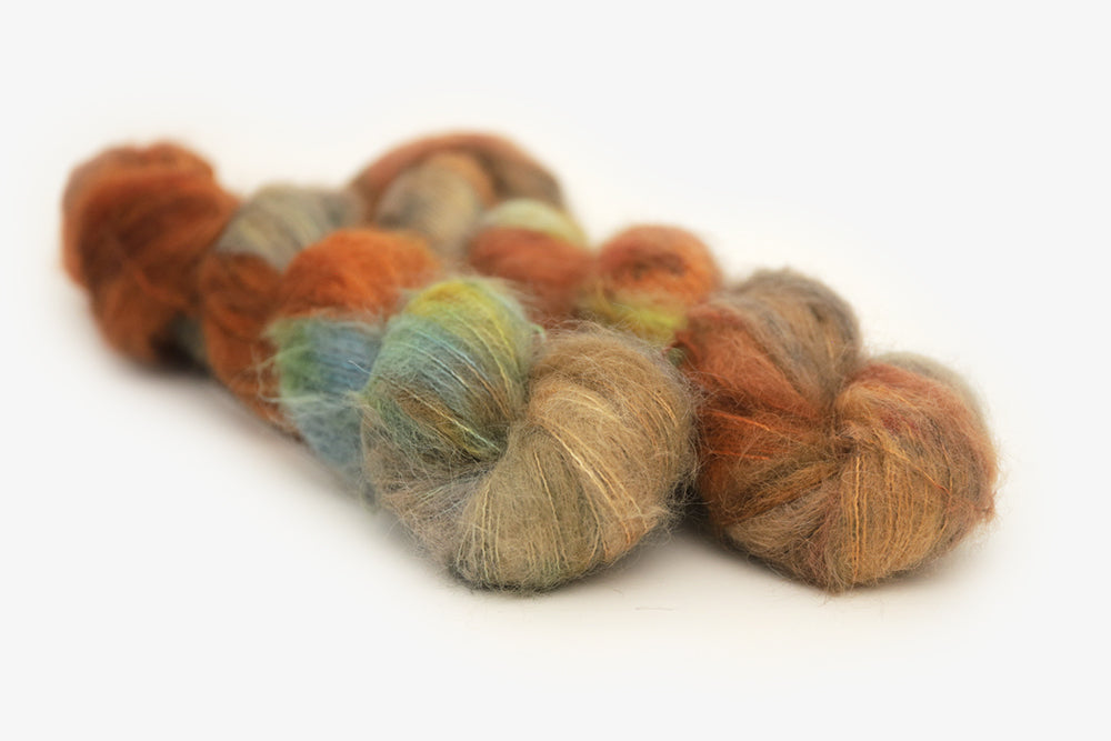 speckled hand dyed burnt orange teal green alpaca suri lace yarn