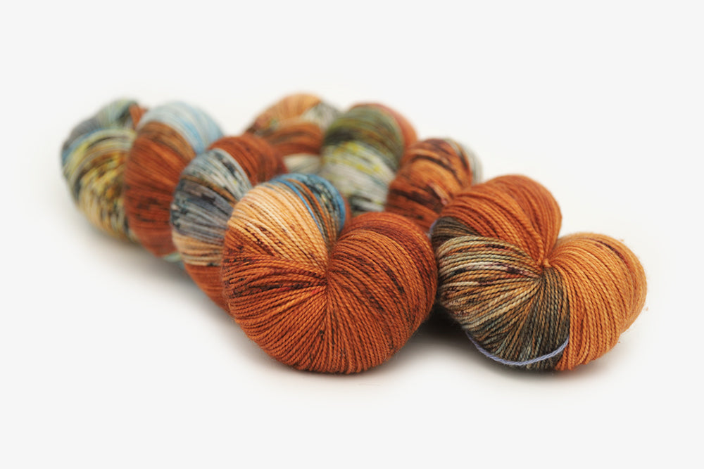 speckled hand dyed burnt orange teal green spun xl yarn